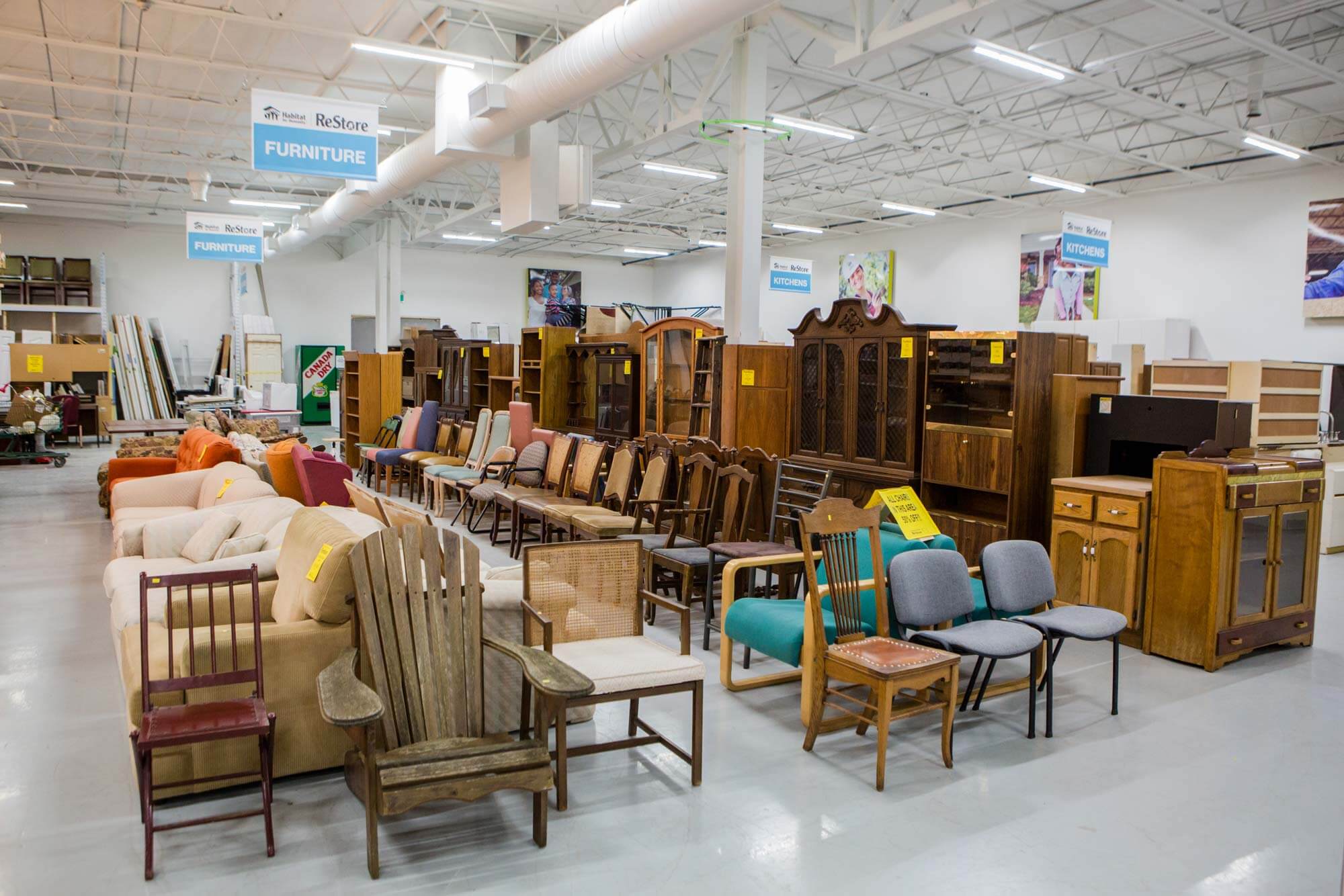 The ReStore showroom floor, full of a variety of well organized chairs, dressers and sofas