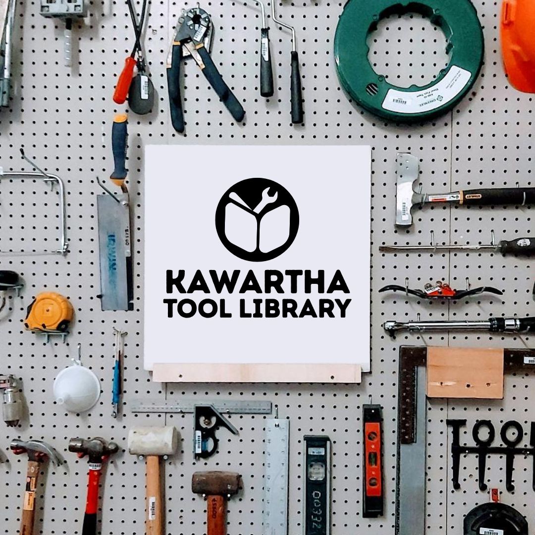 A peg wall of tools with the Kawartha Tool Library logo in the centre